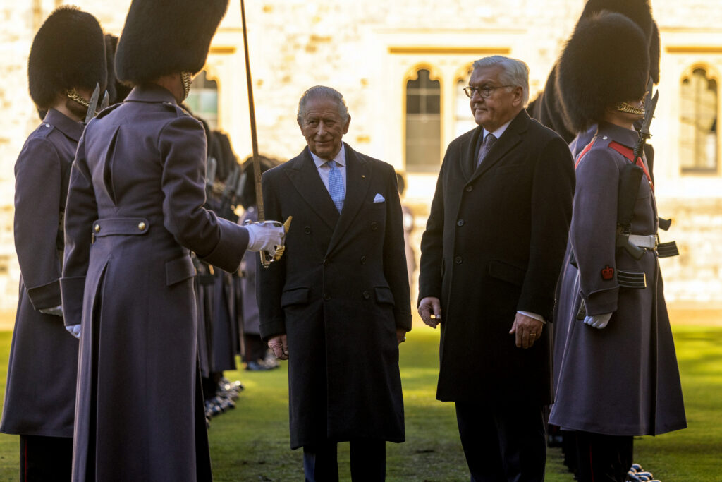 King Charles and the President of Germany talk to a soldier