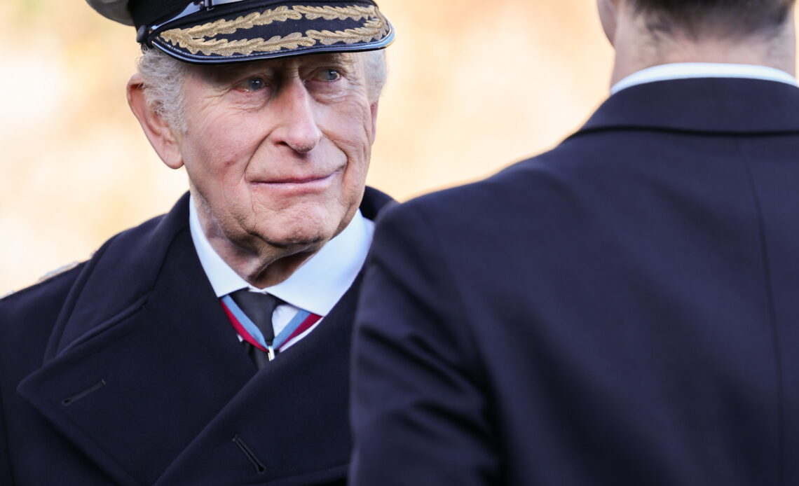 King Charles wears a naval cap during a visit to Dartmouth