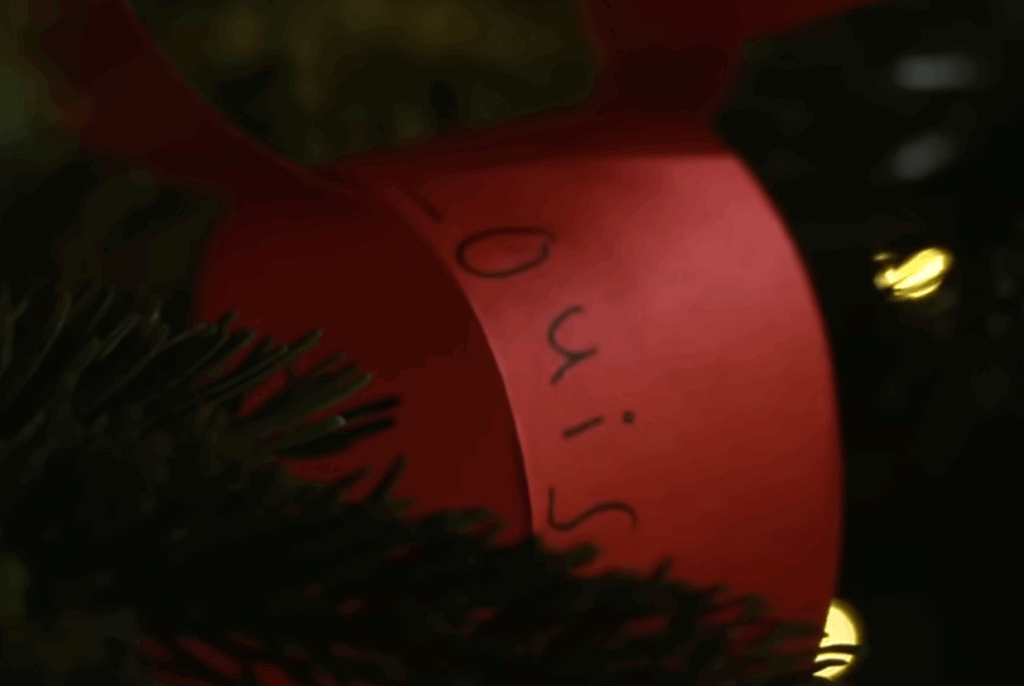 A red loop of paper with Louis written on it, created by Prince Louis