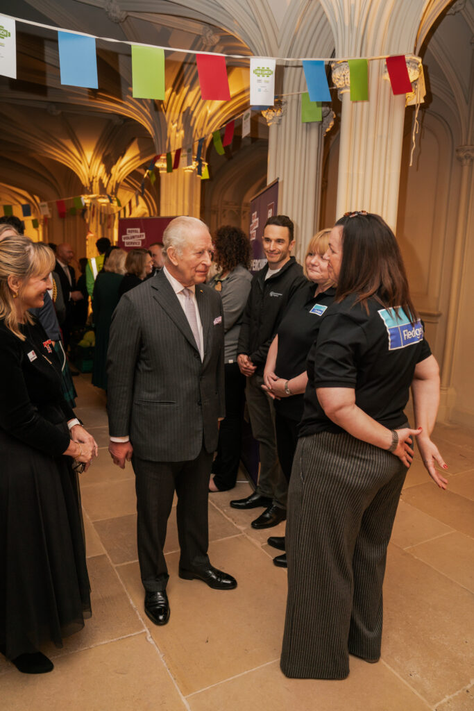 King Charles talks to a group of people