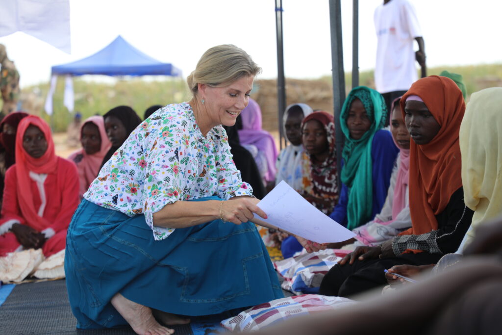 The Duchess of Edinburgh talks to a woman in Sudan