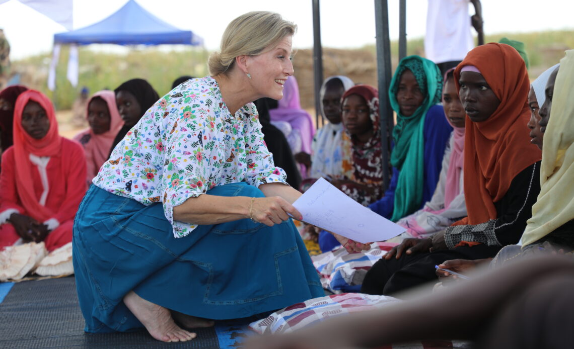 The Duchess of Edinburgh talks to a woman in Sudan