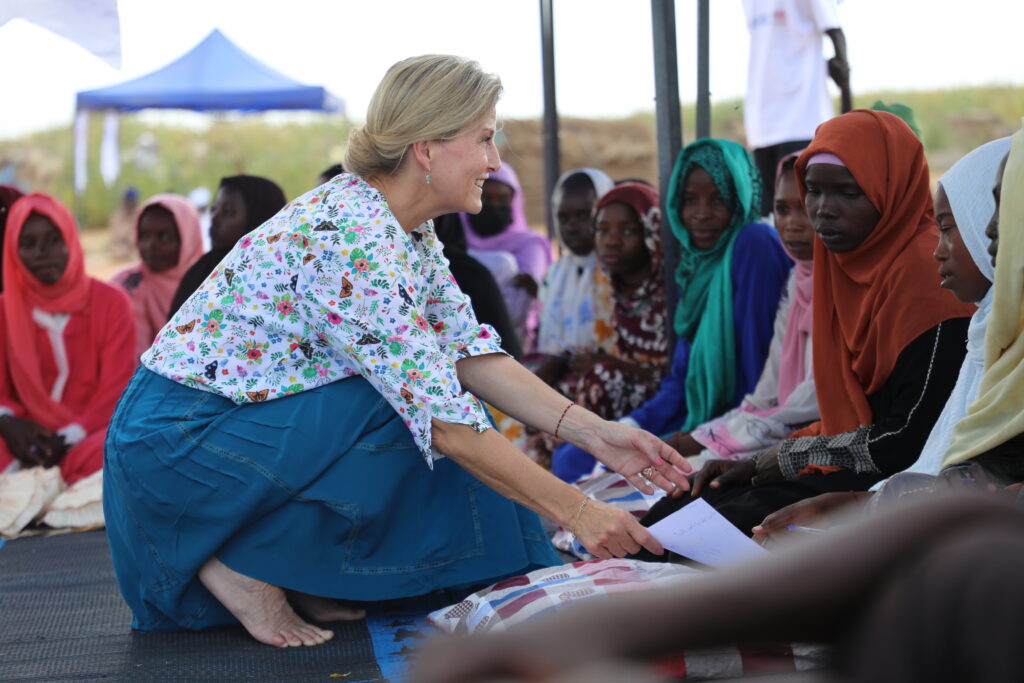 The Duchess of Edinburgh talks to a woman in Sudan