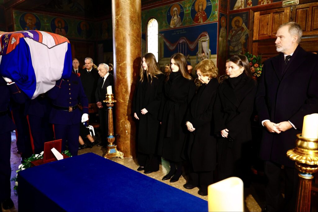 Queen Sofia bows her head as the coffin of her sister, Princess Irene, is carried into church
