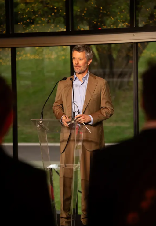 King Frederik smiles as he gives a speech