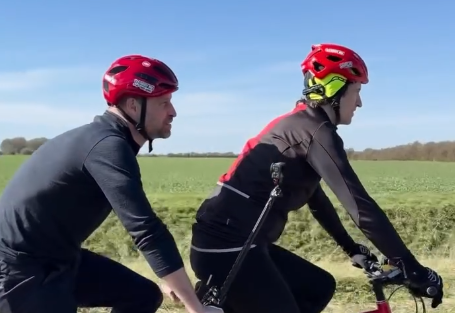 Prince William rides on a tandem with Greg James