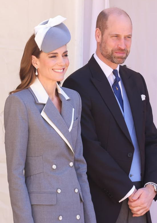 The Princess of Wales wears a grey and white double breasted coat dress 
