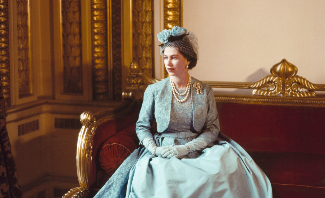 Queen Elizabeth II wears pale blue