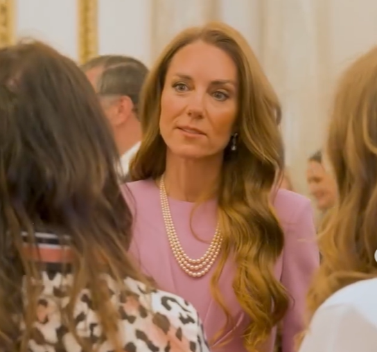 The Princess of Wales wears a pink dress with three string pear l necklace