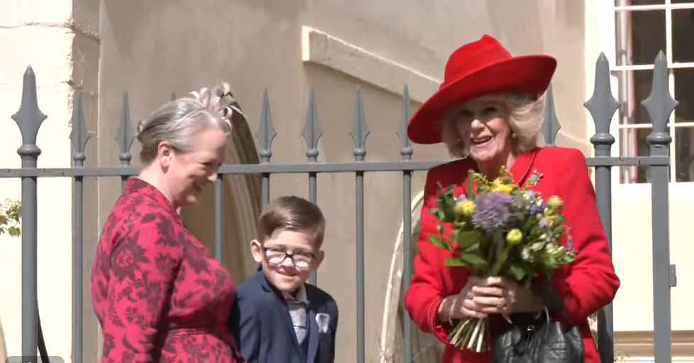 Queen Camilla carries a bouquet of spring flowers on Easter Sunday