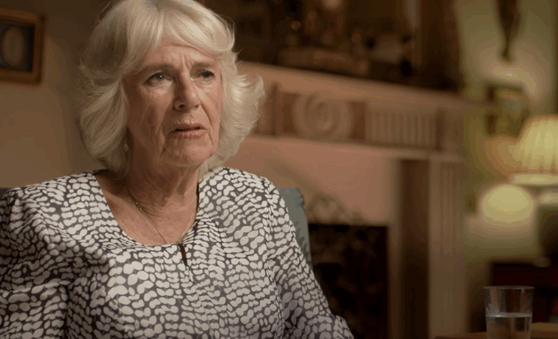 Queen Camilla wears a black and white dress