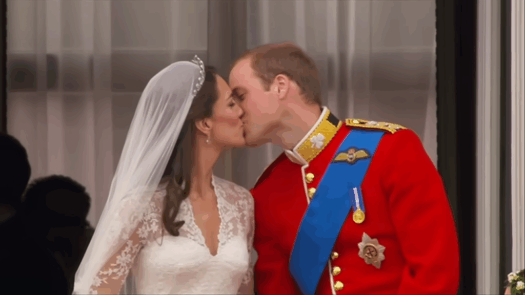 William and Catherine sharing a kiss on the balcony of Buckingham Palace following their royal wedding